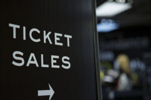 A black and white letter sign with the words Ticket Sales on it.